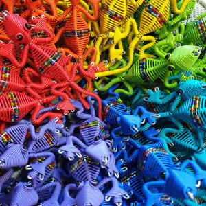 Gecko shaped fridge magnets made from telephone wire in a variety of vibrant colours.